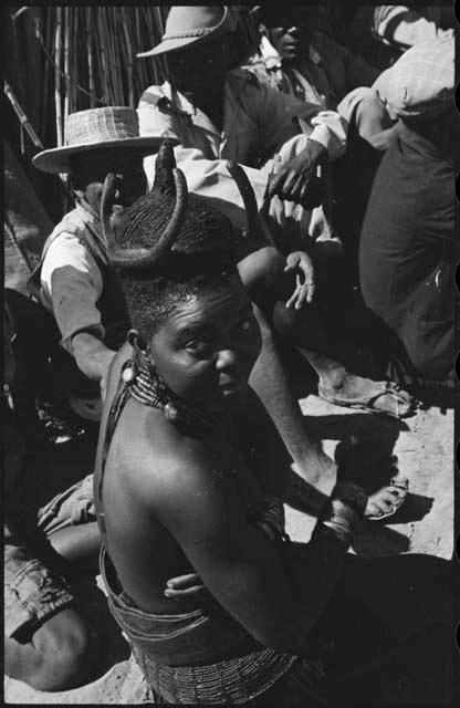 Woman sitting with a group, close-up