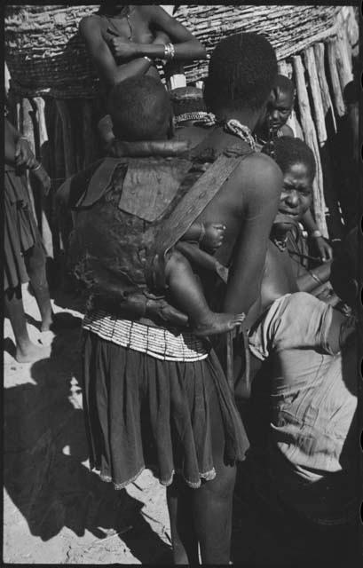 Woman carrying a baby on her back