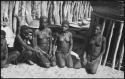 Four women kneeling