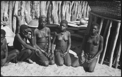 Four women kneeling