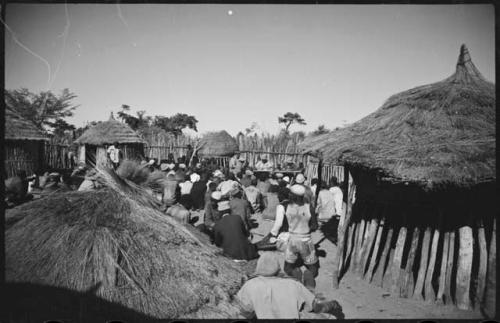 Group of people standing inside kraal