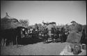 Group of people standing inside kraal