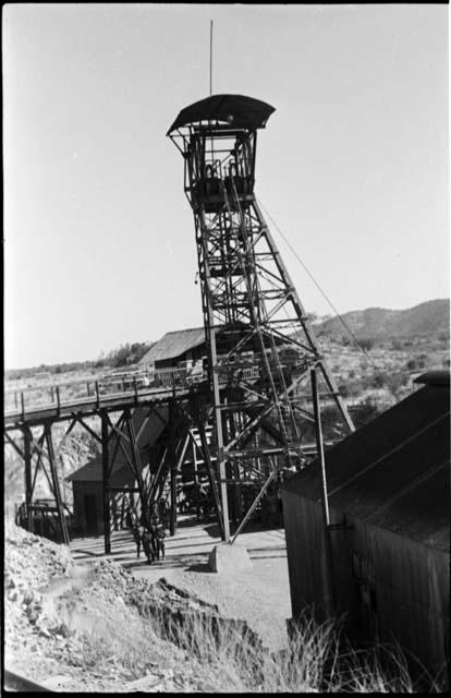 Group of people standing underneath equipment at Abenab Mine