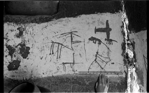 Drawings on a wall in an Okwa hut by local children