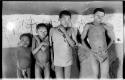 Boys standing in front of the wall drawings