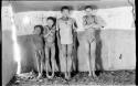 Boys standing in front of the wall drawings