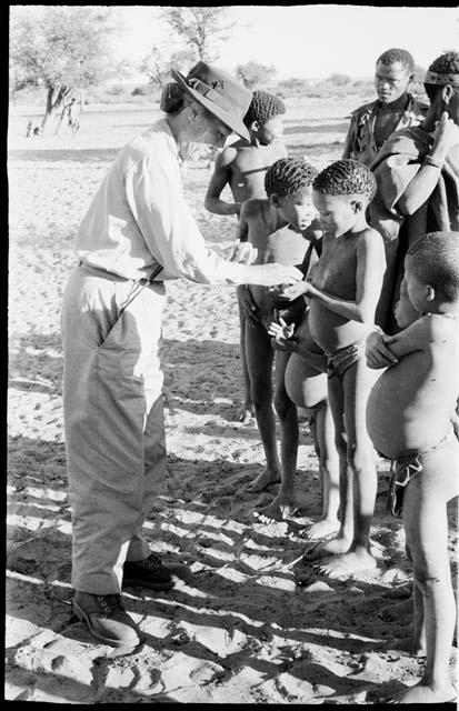 Children receiving food from Lorna Marshall at Okwa