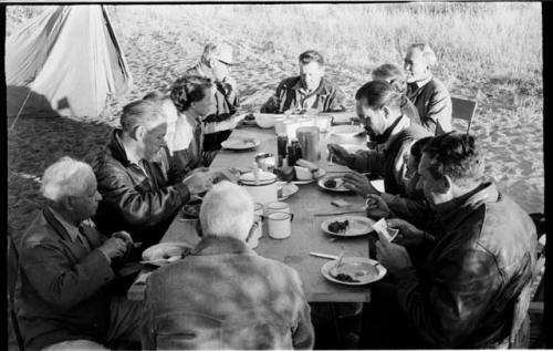 Knoble and his group sitting at a table eating