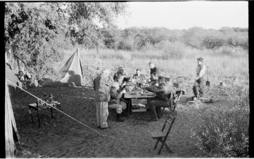 Knoble and his group sitting at a table eating