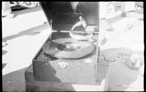 Boys' phonograph open, sitting on a crate