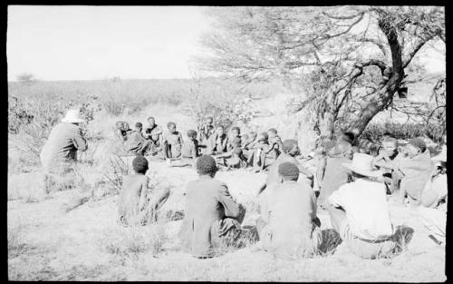 Group of people sitting in a large circle