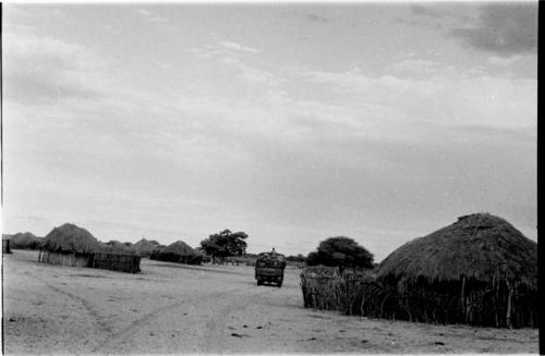 Truck driving through a local village