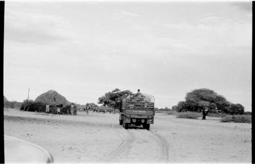 Truck driving through a local village
