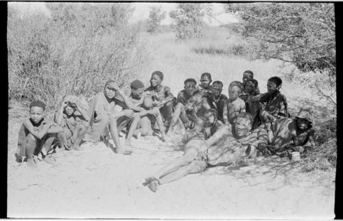 Group of people sitting under a tree