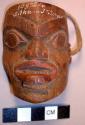 Miniature mask with rawhide strap. Painted.