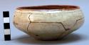 Bowl, ceramic. white slip exterior, finely incised patterns and decorative paint