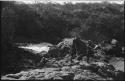 Two men standing next to the rapids at Ruacana Falls