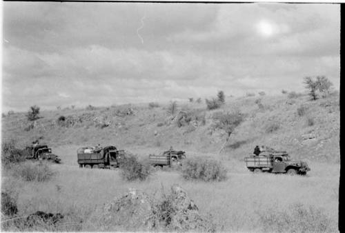 Four trucks in a riverbed out from Molepolole