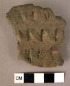 Potsherd with a finger tip ornament