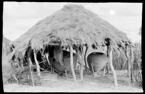 Large storage baskets under an open hut