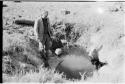 Theunis Berger standing by a dug waterhole at Kungwane