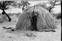 Hut with poles at the door