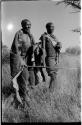 Elderly blind man and his companion, both holding a long stick