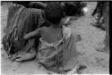 Rear view of a child sitting in a group