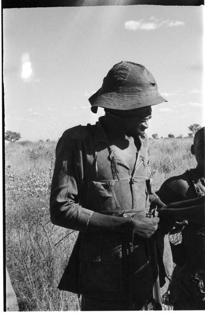 Headman wearing a hat, standing