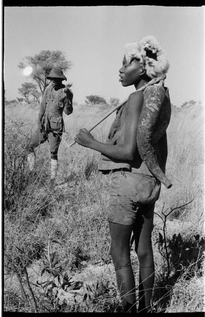 Headman wearing a hat, standing near a boy wearing a fur cap