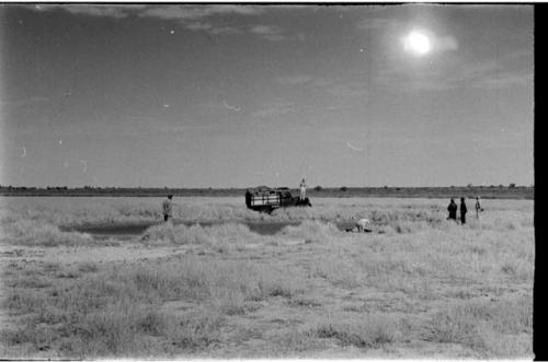 Expedition members and trucks at !Kusi Pan, distant view