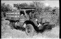 Expedition member sitting on the front of a truck