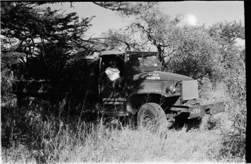 Expedition member sitting in truck