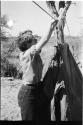 Elizabeth Marshall Thomas putting up a tent