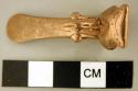 Gold head of animal, stylized, with platypus beak.  Use is unclear.