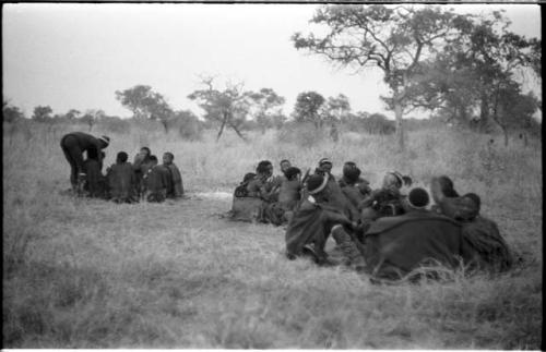 Medicine man and a group of people