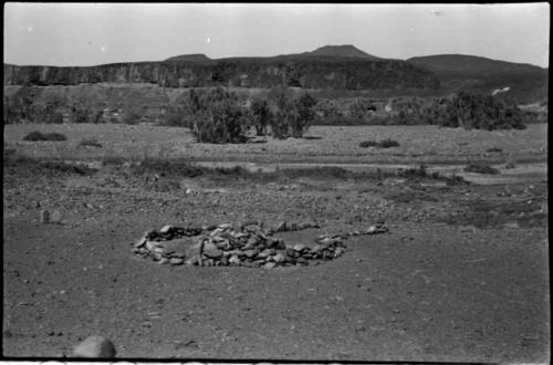 Pile of stones in circle with space for entrance