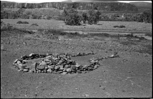 Pile of stones in circle with space for entrance