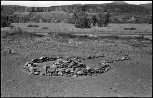 Pile of stones in circle with space for entrance