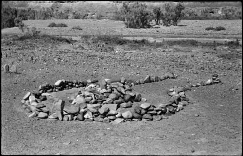 Pile of stones in circle with space for entrance