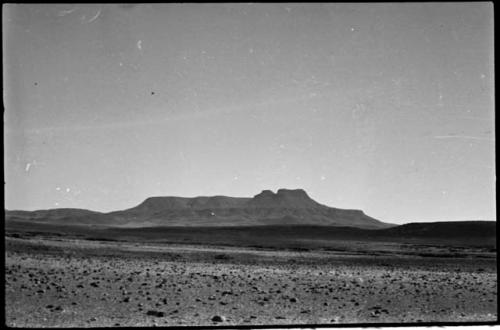 Desert landscape with hills in distance