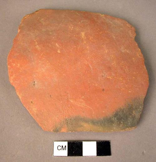 Black mottled red potsherd - slipped