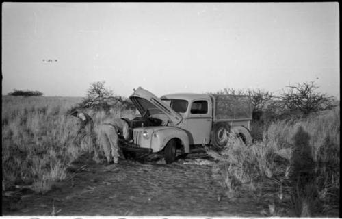 Men fixing an expedition truck