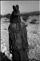 Woman wearing headdress, back