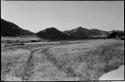 Truck tracks, with mountains in background