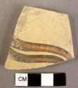 Potsherd - fragment of naturalistic design on burnished yellow slip; possibly "P