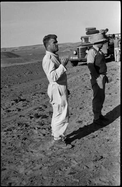 Expedition members standing near a truck