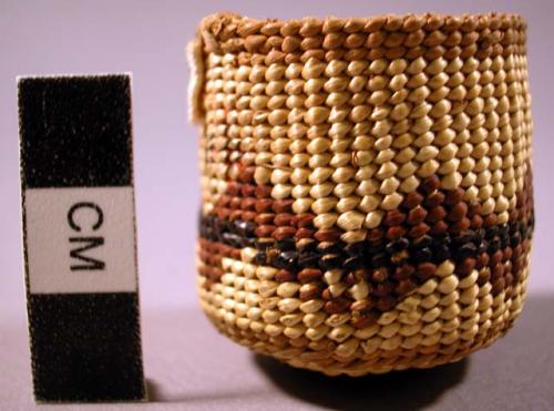 Basketry cover to basketry-covered glass bottle