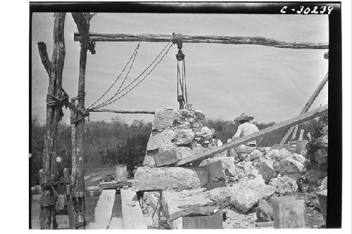 Caracol. Repair of SW corner of cornice of lower platform.