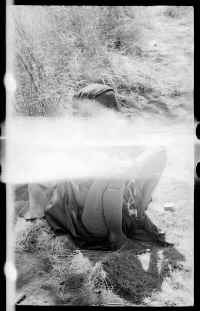 Ju/'hoan individual, seated (damaged negative)